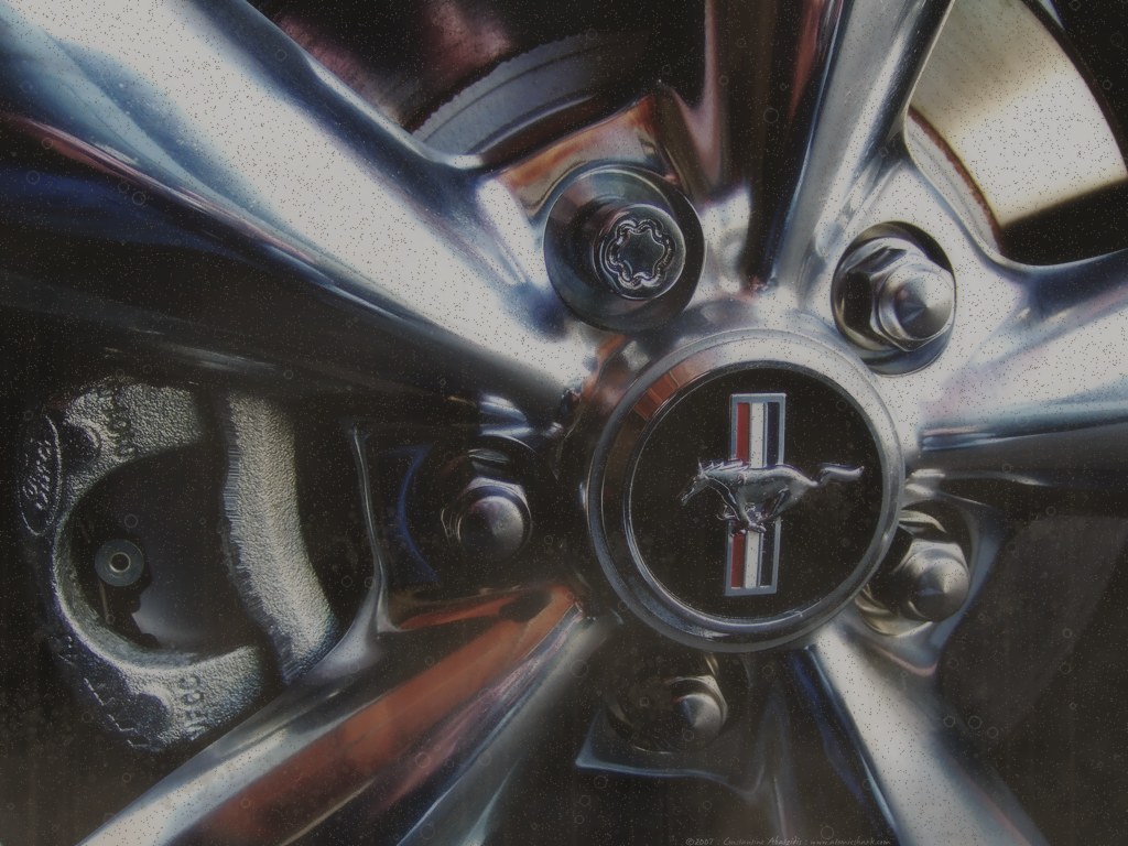 Dull dusty alloy wheel caked with brake dust before detailing