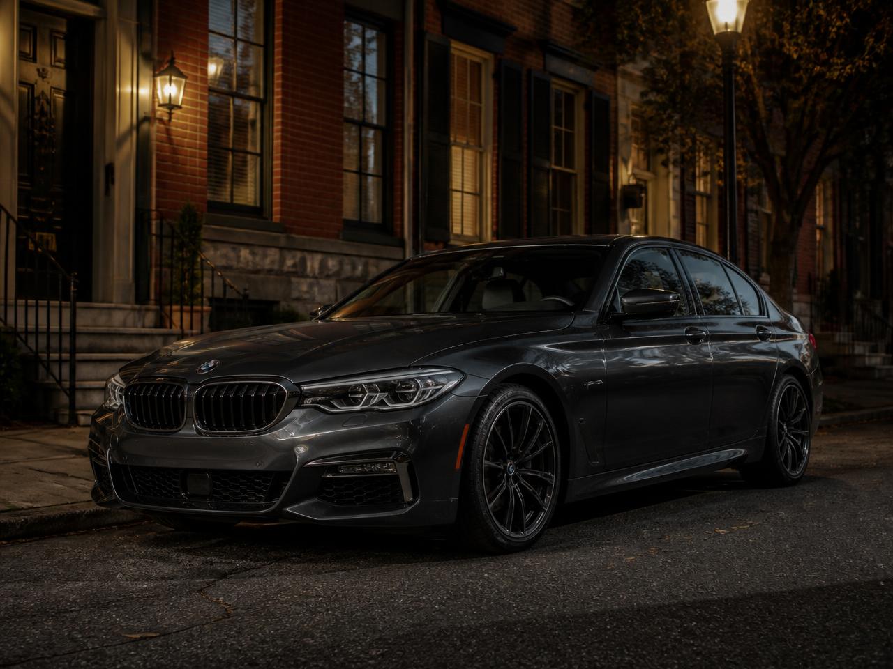 Clean grey sedan detailed on a Philadelphia rowhouse street